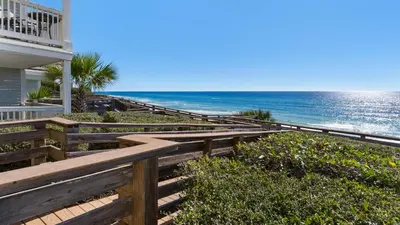 a set of wooden stairs leading to the beach at Mistral 6 in Seacrest