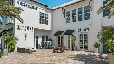 a building with a patio in front of it at Mistral 6 in Seacrest