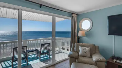 a living room with a view of the ocean at Mistral 10 in Seacrest