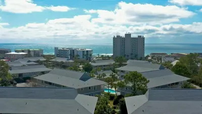an aerial view of a city with buildings and the ocean at Beachwood Villas 4G in Santa Rosa Beach
