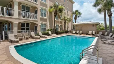 a swimming pool in front of a building at Monterey Condos A302 in Panama City Beach