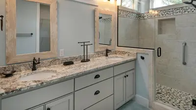 a bathroom with two sinks and a shower at Blue Bungalow in Santa Rosa Beach