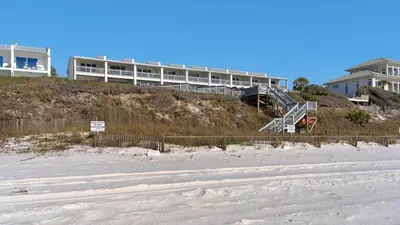 a building on top of a hill with a beach at Blue Nine 9 in Panama City Beach
