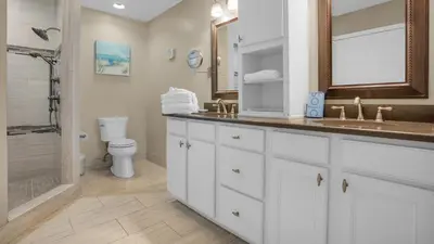 a bathroom with a sink and a toilet and a shower at Blue Tide 3B in Panama City Beach
