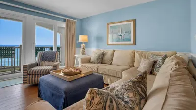 a living room with a couch and a table at Blue Tide 3B in Panama City Beach