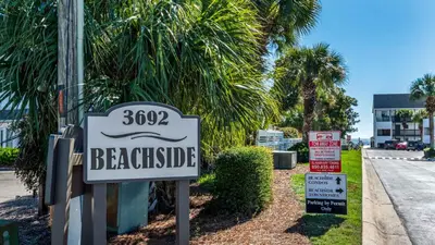 a sign for a beachside sign for a house at Beachside Condo 1 in Santa Rosa Beach