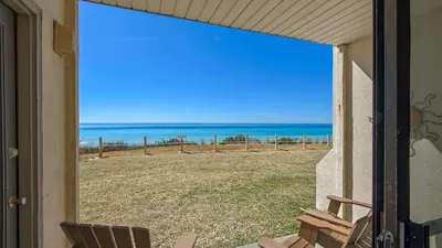 a view of the ocean from the porch of a house at Beachside Condo 1 in Santa Rosa Beach