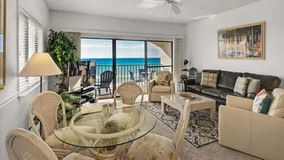 a living room with a view of the ocean at Palms C11 in Santa Rosa Beach