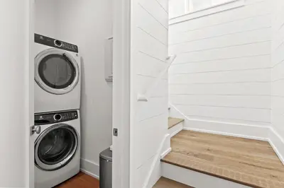 a laundry room with a washer and dryer at Maison de Joie in Inlet Beach