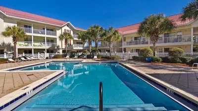a swimming pool in front of a apartment complex at Rollin Tide C8 in Santa Rosa Beach