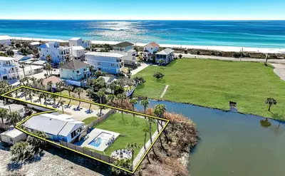 an aerial view of a house next to the ocean at Leo's Hideaway in Panama City Beach
