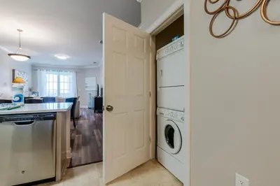 a kitchen and laundry room with a washer and dryer at Village of South Walton 314D - Serenity in Rosemary Beach