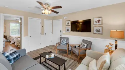 a living room with a couch and a tv at Beachside Villas 1122 in Santa Rosa Beach