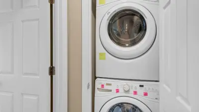 a washing machine and a washer and dryer in a room at Beachside Villas 1122 in Santa Rosa Beach