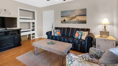 a living room with a couch and a coffee table at Beachwood Villas 3A in Santa Rosa Beach