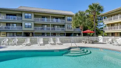 a hotel with a swimming pool in front of a building at Beachwood Villas 4C in Santa Rosa Beach