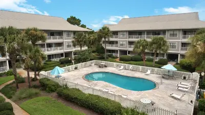 an aerial view of a resort with a pool and a building at Beachwood Villas 4C in Santa Rosa Beach