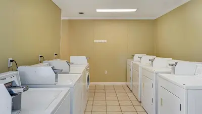 a room filled with white washing machines in a room at Beachwood Villas 8D in Santa Rosa Beach