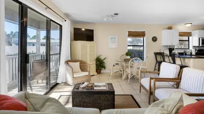 a living room with a couch and a table at Beachwood Villas 13A in Santa Rosa Beach