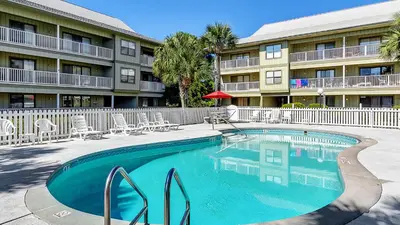 a swimming pool in front of a apartment building at Beachwood Villas 13A in Santa Rosa Beach