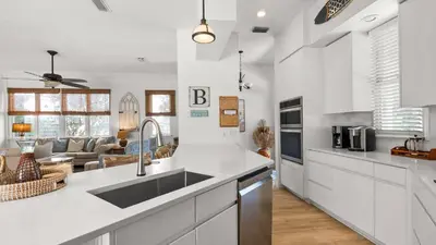 a kitchen with a sink and a counter top at Crow's Nest in Santa Rosa Beach