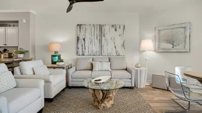 a living room with a couch and a table at Dunes Of Seagrove 201B in Santa Rosa Beach