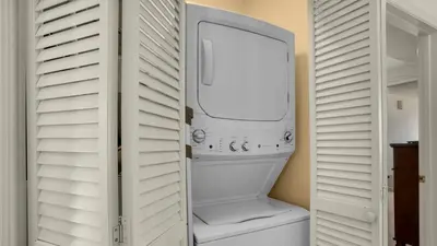 a white washer and dryer in a white closet at Dunes Of Seagrove 202C in Santa Rosa Beach