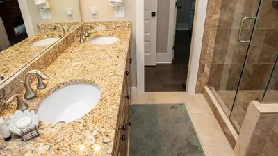 a bathroom with two sinks and a shower at Dolphin House in Santa Rosa Beach