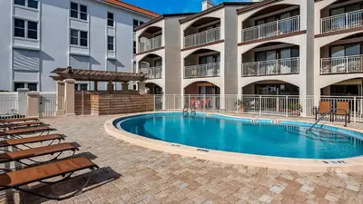 a swimming pool in front of a apartment building at Dune Villas 5A in Santa Rosa Beach