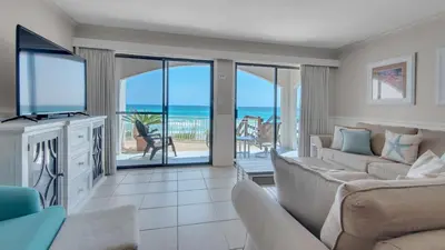 a living room with a couch and a television at Dune Villas 5A in Santa Rosa Beach