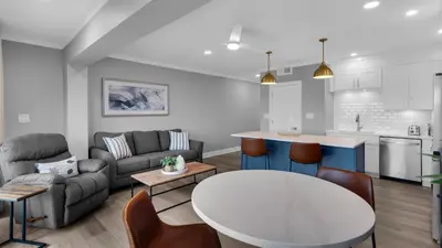 a living room with a couch and a table at Emerald Hill 1 in Santa Rosa Beach