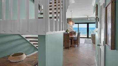 a staircase in a house with a view of the ocean at Emerald Hill 6 in Santa Rosa Beach