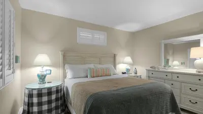 a white bedroom with a bed and a sink at Emerald Hill 9 in Santa Rosa Beach