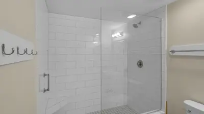 a bathroom with a shower with a glass door at Emerald Hill 9 in Santa Rosa Beach