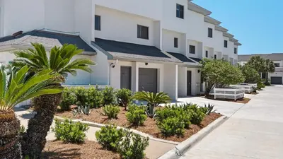 a house with trees and plants in front of it at Emerald Hill 11 in Santa Rosa Beach