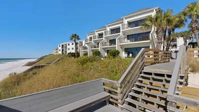 a building on the beach next to the beach at Emerald Hill 11 in Santa Rosa Beach