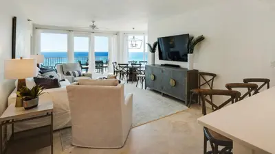 a living room with a view of the ocean at Tranquillity 340 in Panama City Beach