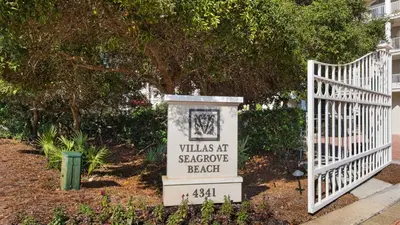 a white gate with a sign that says villas at strawberry beach at Villas At Seagrove C401 in Santa Rosa Beach