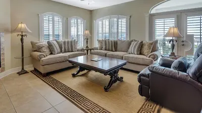 a living room with couches and a coffee table at Villas At Seagrove C401 in Santa Rosa Beach