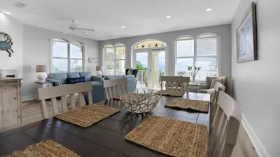 a dining room and living room with a dining table at Monterey Condos A201 in Panama City Beach