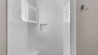 a bathroom with a shower with a window and a shower at Emotional Rescue in Inlet Beach