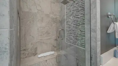 a bathroom with a shower with a glass door at Sea Echo in Santa Rosa Beach