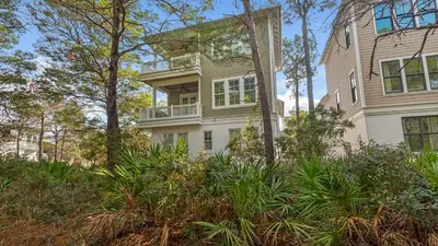 an image of a house with trees and plants at Sea Echo in Santa Rosa Beach