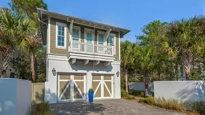 a house with a balcony and a garage at Sea Echo in Santa Rosa Beach