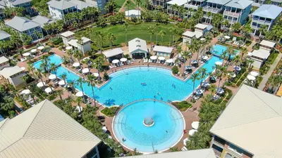an overhead view of a pool at a resort at License To Chill in Inlet Beach