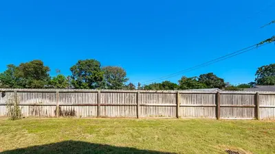 a wooden fence in a yard at Seabreeze in Panama City Beach