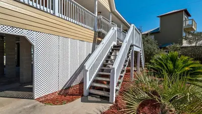 a white staircase leading up to a house at Beach Daze in Panama City Beach