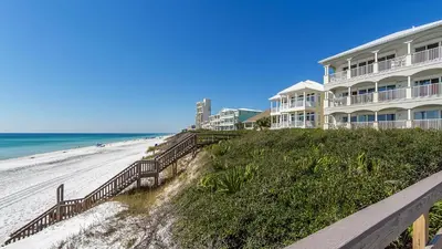 a building on a hill next to the beach at Seagrove By The Sea IIC in Santa Rosa Beach