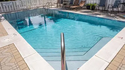 a large swimming pool with blue water at Seagrove By The Sea IIC in Santa Rosa Beach