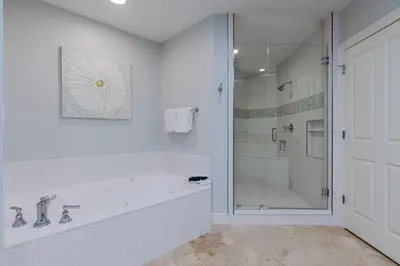 a white bathroom with a tub and a shower at Legacy 402-Flemingo's Paradise in Seagrove Beach